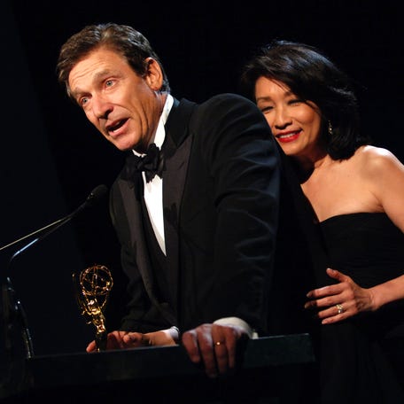 Maury Povich speaks with wife Connie Chung at the 2006 New York Emmy Awards at the the Marriott Marquis on March 12, 2006, in New York City. Povich won the Governors Award, which is an honorary Emmy that recognizes outstanding achievements in the television industry.