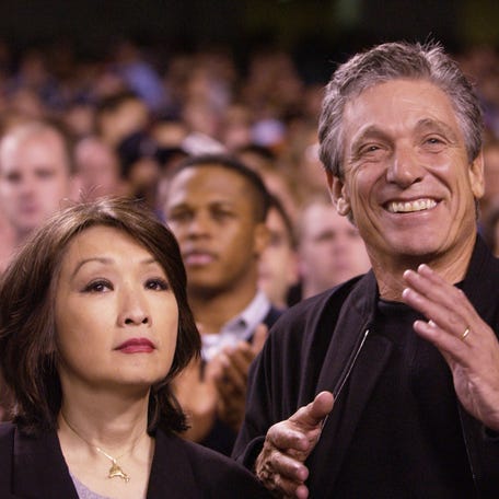 Maury Povich and wife Connie Chung watch the game between the Tampa Bay Devil Rays and the New York Yankees in 2001 at Yankee Stadium in the Bronx, New York.
