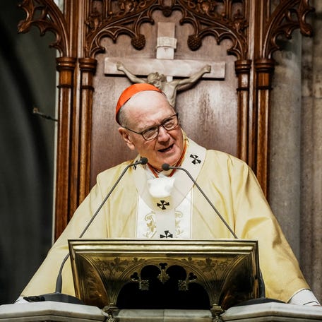 New York Archbishop Timothy Dolan attends the mass before blessing food donations prepared by Catholic Charities for families in need ahead of Thanksgiving week, outside St. Patrick's Cathedral in New York City, U.S., November 23, 2025.