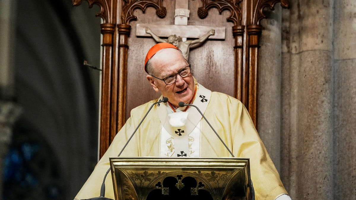 New York Archbishop Timothy Dolan attends the mass before blessing food donations prepared by Catholic Charities for families in need ahead of Thanksgiving week, outside St. Patrick's Cathedral in New York City, U.S., November 23, 2025.