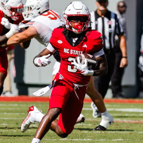 North Carolina State running back Hollywood Smothers (3) runs with the ball during the first half against Campbell at Carter-Finley Stadium.