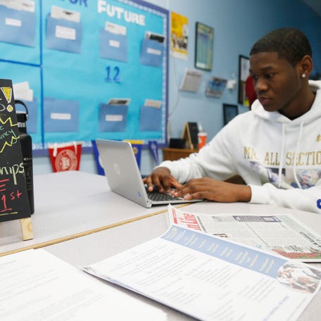 Jamik Fernandez-Carter fills out his FAFSA at the Career Action Center at Poughkeepsie High School on March 1, 2019.     Fafsa Poughkeepsie