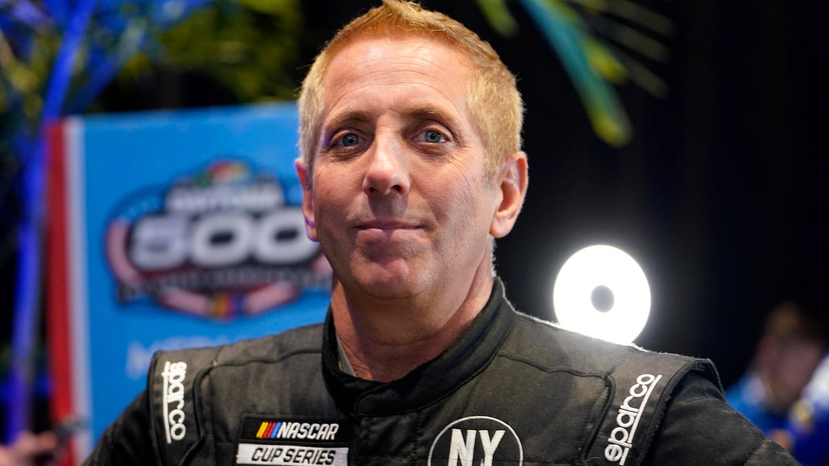Greg Biffle talks to reporters during Daytona 500 media day at Daytona International Speedway on Feb. 16, 2022.