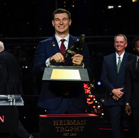 Indiana Hoosiers quarterback Fernando Mendoza wins the Heisman Trophy during the trophy presentation.