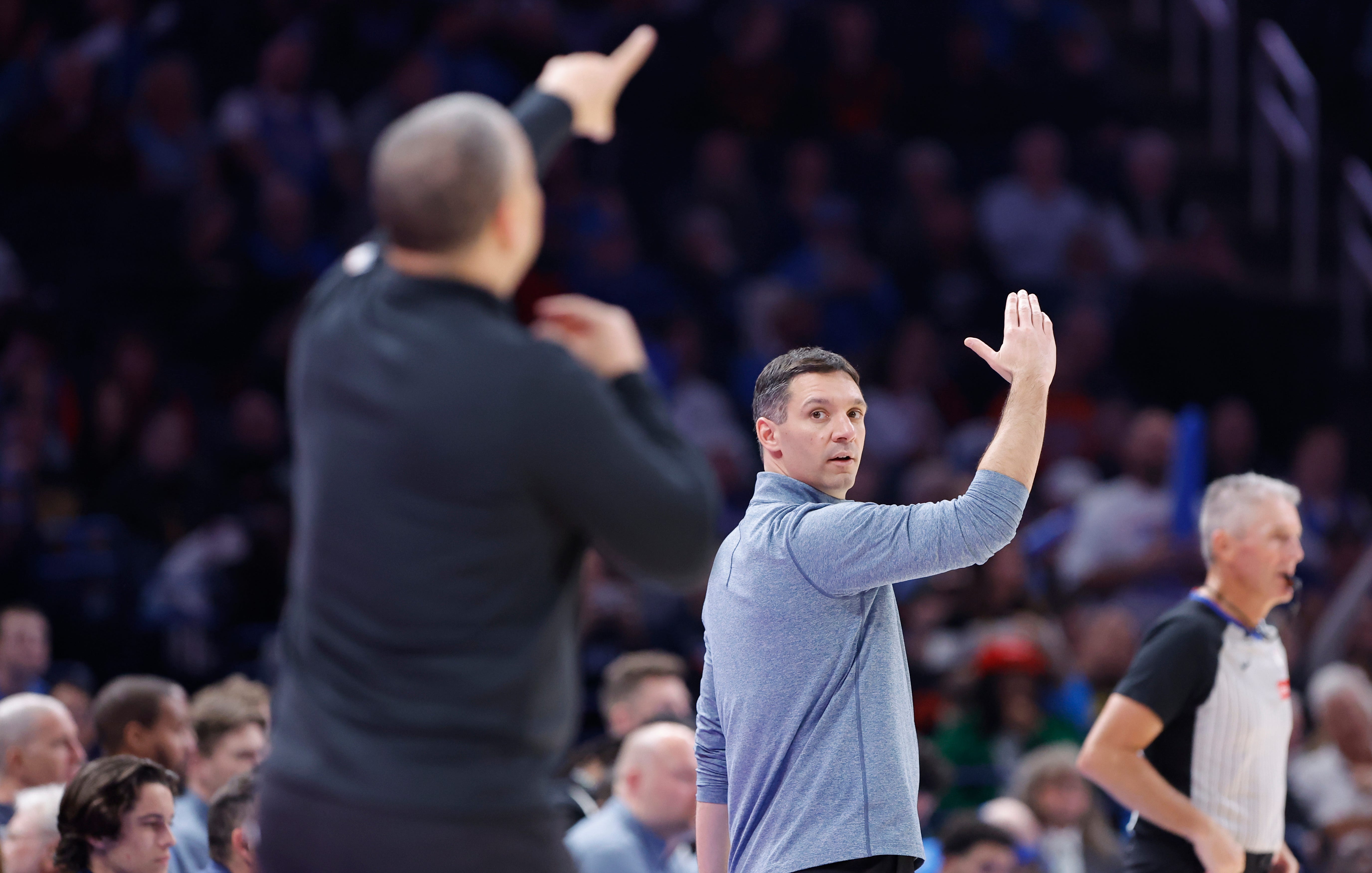 Dec 18, 2025; Oklahoma City, Oklahoma, USA; Oklahoma City Thunder head coach Mark Daigneault looks at Los Angeles Clippers head coach Tyronn Lue and gestures to his team during the second half at Paycom Center. Mandatory Credit: Alonzo Adams-Imagn Images