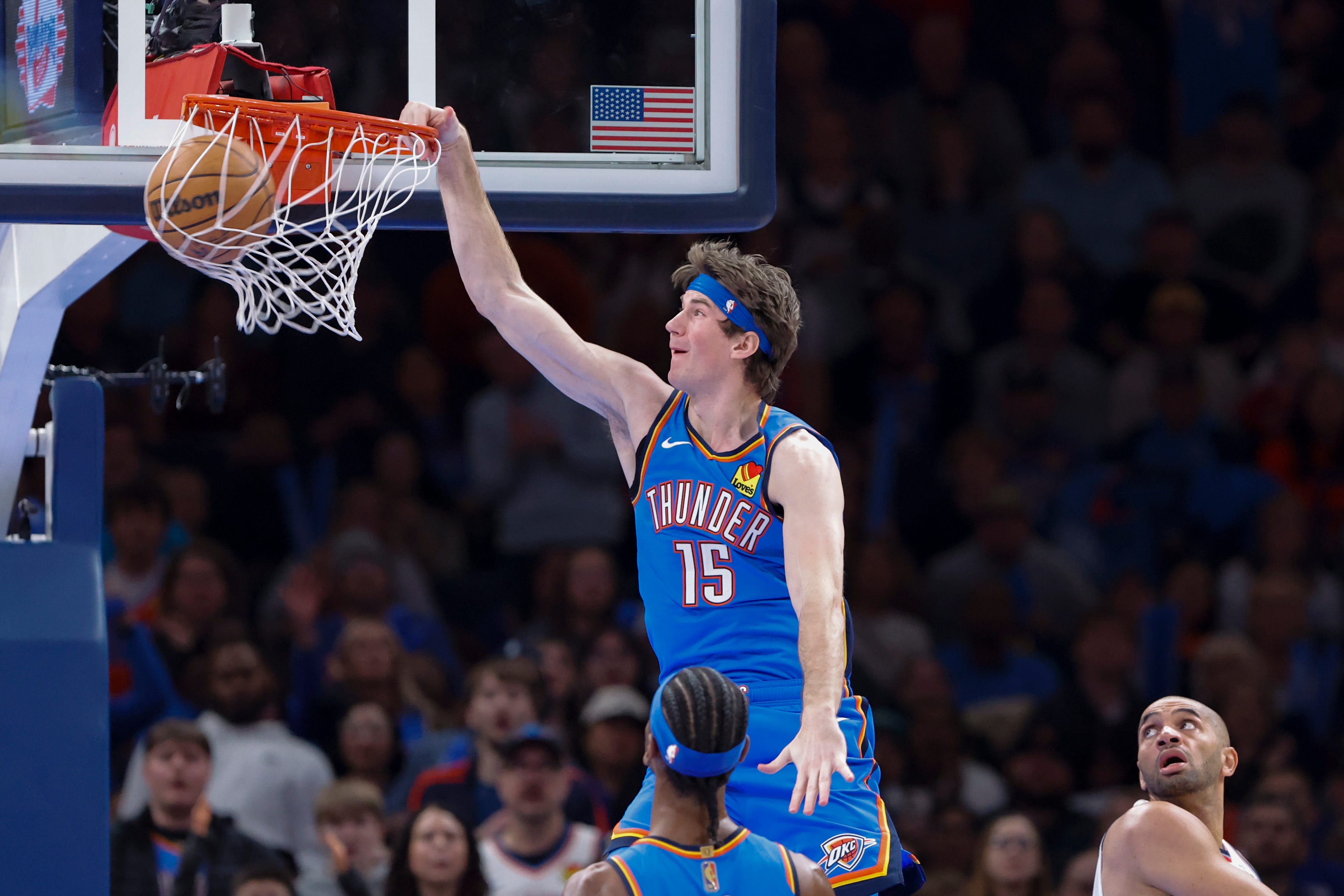 Dec 18, 2025; Oklahoma City, Oklahoma, USA; Oklahoma City Thunder center Branden Carlson (15) dunks against the Los Angeles Clippers during the second half at Paycom Center. Mandatory Credit: Alonzo Adams-Imagn Images