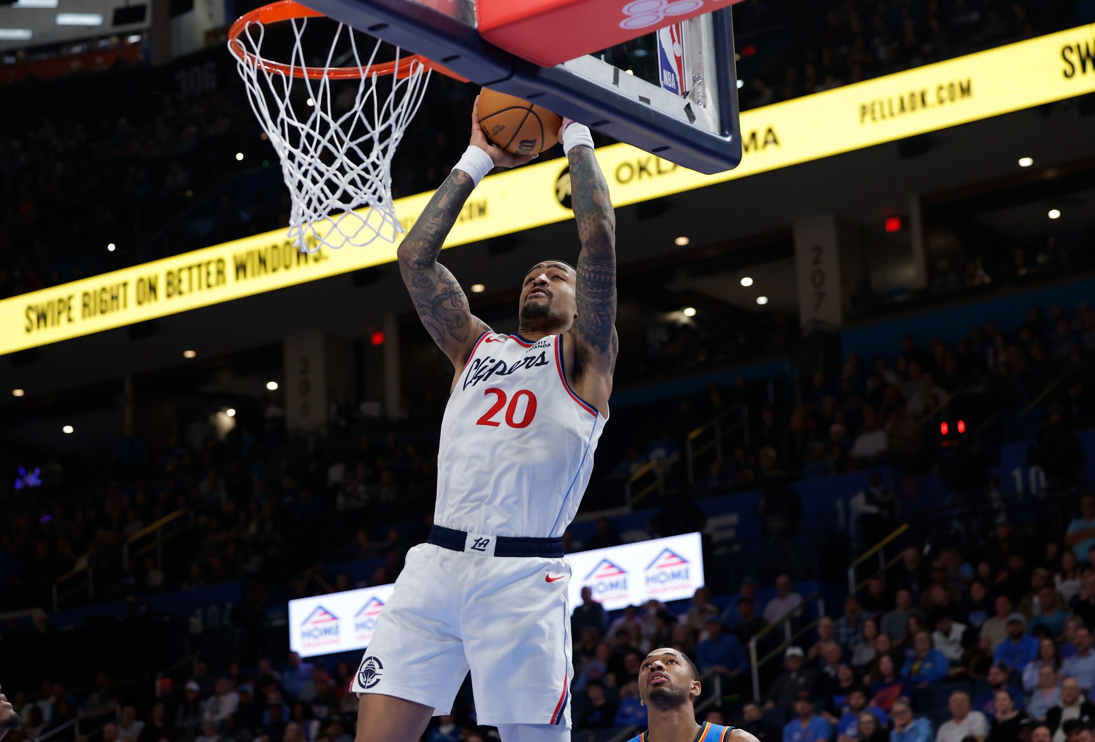 Dec 18, 2025; Oklahoma City, Oklahoma, USA; Los Angeles Clippers forward John Collins (20) goes up for a basket against the Oklahoma City Thunder during the second half at Paycom Center. Mandatory Credit: Alonzo Adams-Imagn Images
