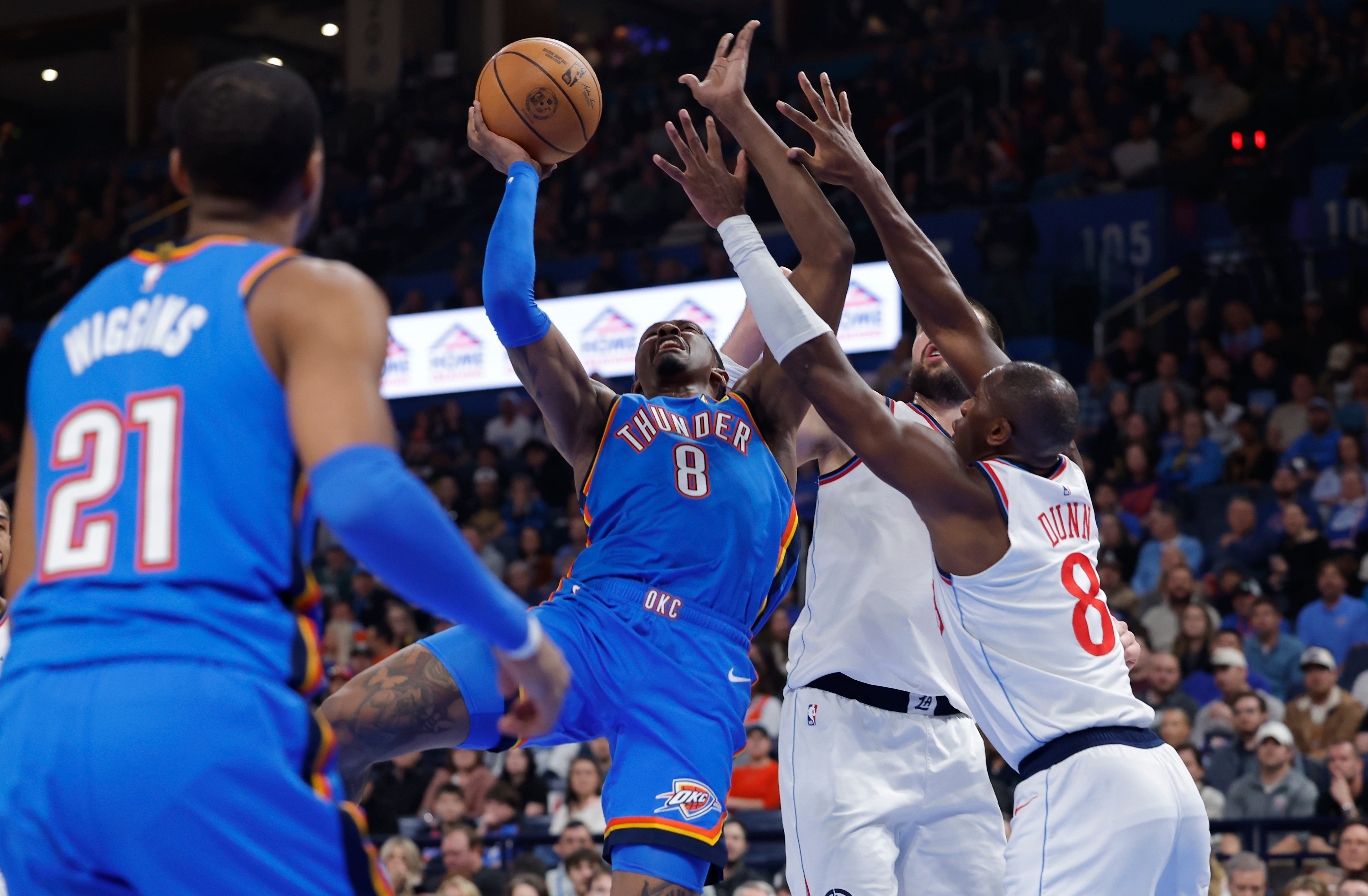 Dec 18, 2025; Oklahoma City, Oklahoma, USA; Oklahoma City Thunder guard Jalen Williams (8) shoots as Los Angeles Clippers guard Kris Dunn (8) defends during the second quarter at Paycom Center. Mandatory Credit: Alonzo Adams-Imagn Images