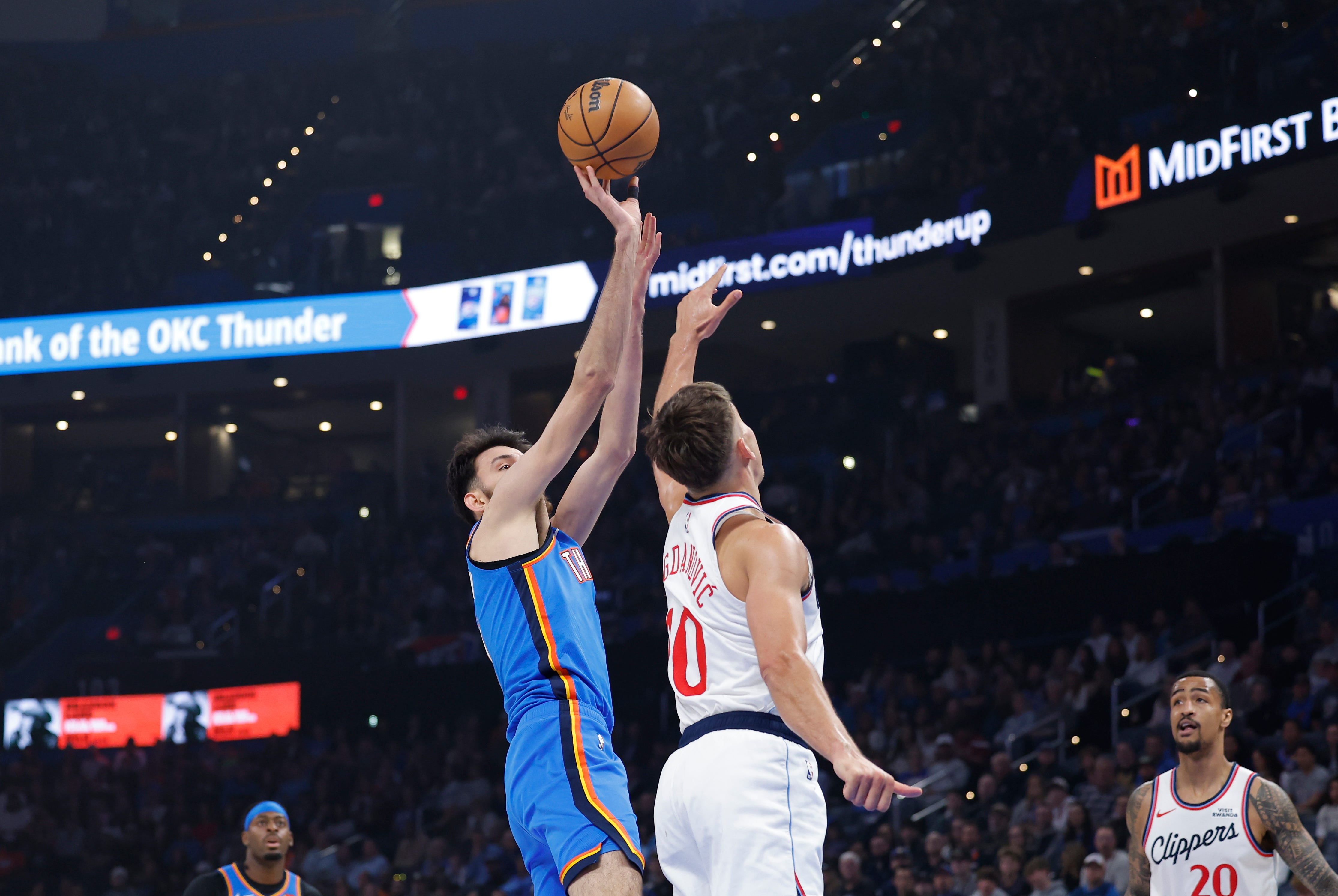 Dec 18, 2025; Oklahoma City, Oklahoma, USAOklahoma City Thunder center Chet Holmgren (7) shoots over Los Angeles Clippers guard Bogdan Bogdanovic (10) during the first quarter at Paycom Center. Mandatory Credit: Alonzo Adams-Imagn Images