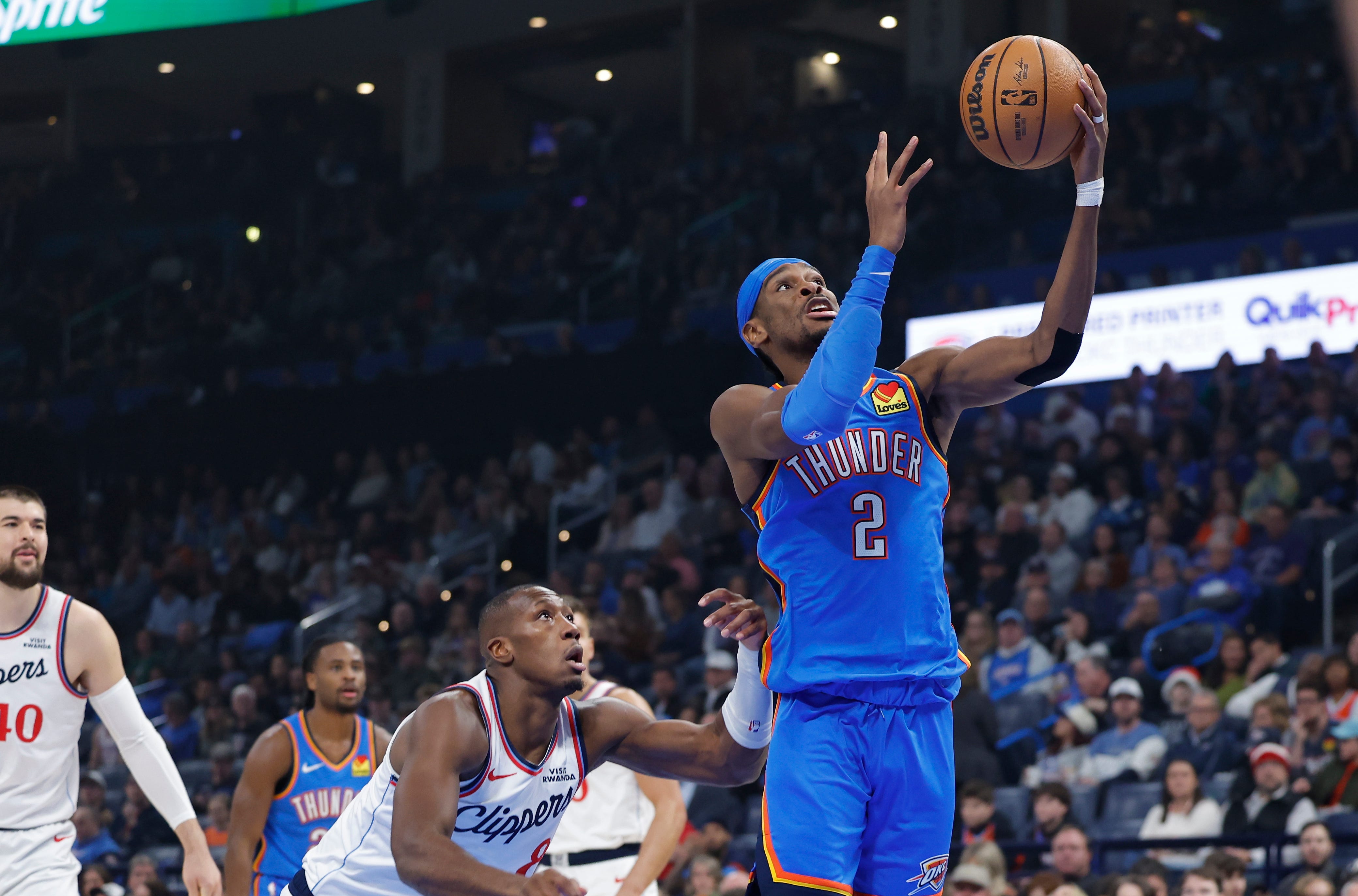 Dec 18, 2025; Oklahoma City, Oklahoma, USA; Oklahoma City Thunder guard Shai Gilgeous-Alexander (2) goes to the basket against the Los Angeles Clippers during the first quarter at Paycom Center. Mandatory Credit: Alonzo Adams-Imagn Images
