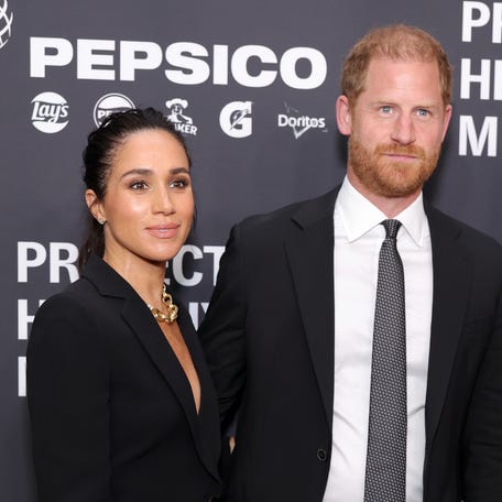 Duchess Meghan, left, and Prince Harry attend the Project Healthy Minds 3rd annual gala at Spring Studios in New York City on Oct. 9, 2025.
