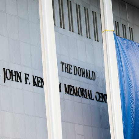 Workers adjust the name of the John F. Kennedy Memorial Center for the Performing Arts" on December 19, 2025 in Washington, DC. The Kennedy Center Board of Trustees voted in what they say was a unanimous decision to rename the facility.