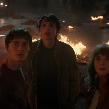 Noah Schnapp as Will Byers, Finn Wolfhard as Mike Wheeler, and Winona Ryder as Joyce Byers in "Stranger Things."