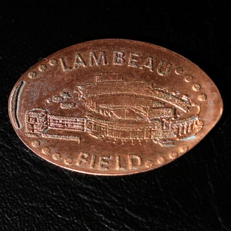 A Lambeau Field pressed penny from a machine in the Packers Pro Shop pictured on Jan. 24, 2022, in Green Bay, Wis.    Gpg Lambeaupenny 012422 Sk23