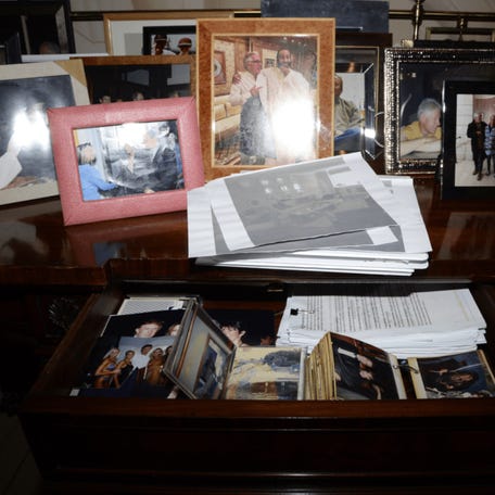 Personal photos are seen on display and in a drawer in this image released by the Department of Justice on Dec. 19, 2025, as part of thousands of files related to Jefferey Epstein. The images in the drawer include images of Donald J. Trump. The images were released by the US DOJ without location information, dates or context.