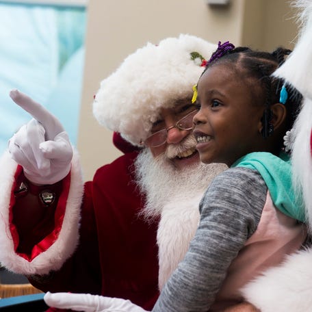 Santa Claus visits with children at a hospital in Savannah, Georgia, in December 2025.