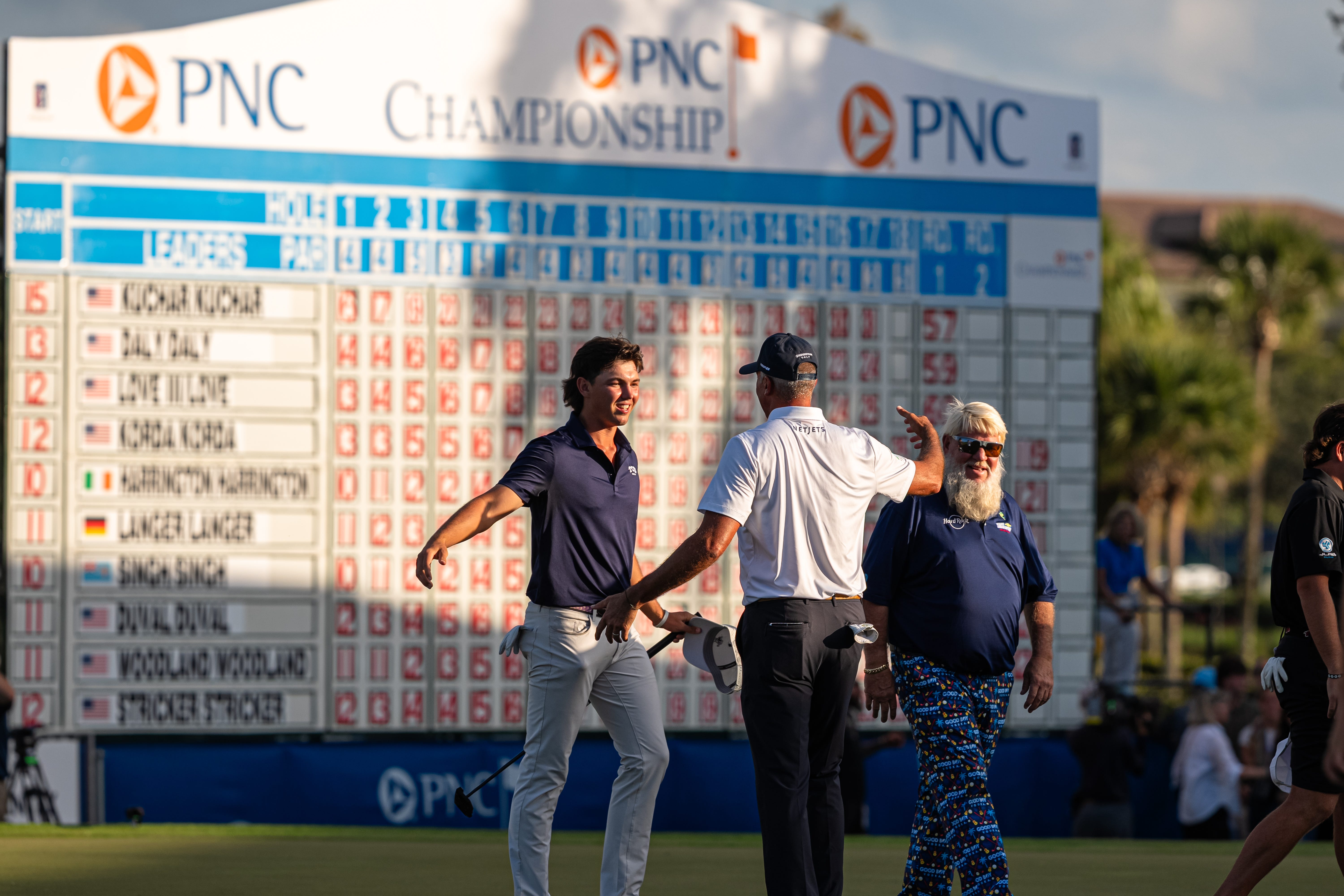 Matt Kuchar and his son Cameron celebrate their victory on the 18th at the PNC Championship.