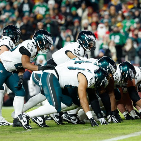 Philadelphia Eagles quarterback Jalen Hurts (1) lines up with the offense before a play against the Washington Commanders in the first half at Northwest Stadium.
