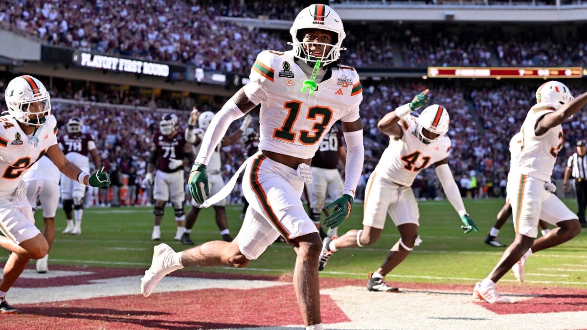 Miami defensive back Bryce Fitzgerald (13) celebrates after he intercepts a Texas A&M pass to clinch a win in the first round of the 2025 College Football Playoff at Kyle Field.