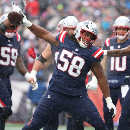 Jared Wilson #58 celebrates after Drake Maye #10 of the New England Patriots scored a first quarter touchdown against the Buffalo Bills at Gillette Stadium on December 14, 2025 in Foxborough, Massachusetts.
