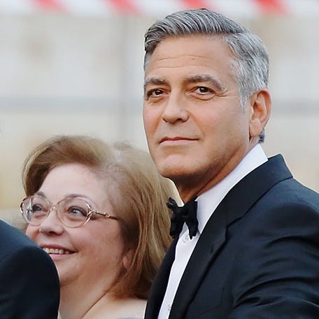 George Clooney (right) arrives at Haman Hotel for his wedding on Sept. 27, 2014, in Venice, with his future father-in-law, Ramzi Alamuddin (left), and his sister Adelia "Ada" Zeidler (center).