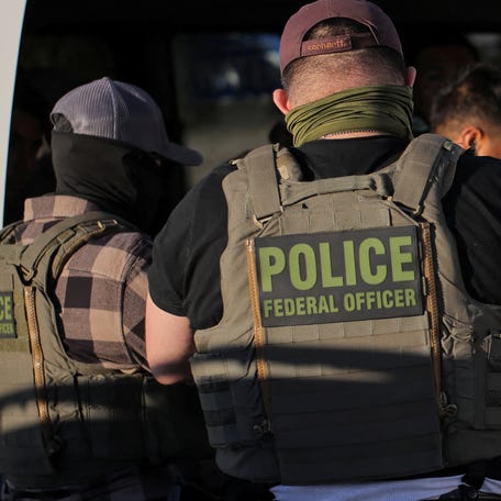 Immigration and Customs Enforcement agents are pictured during an immigration raid in Mecca, California, on Dec. 19, 2025.