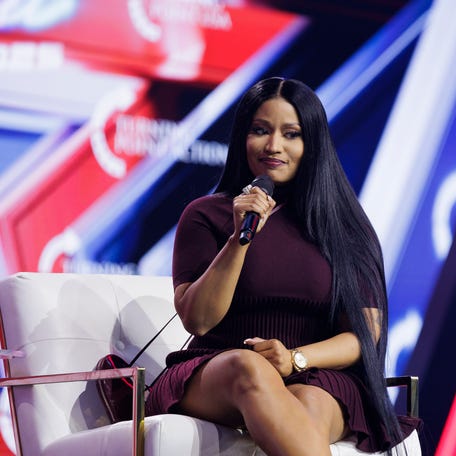 Nicki Minaj speaks at Turning Point USA's AmericaFest conference at the Phoenix Convention Center on Dec. 21, 2025, in Phoenix, Arizona.