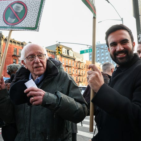 Senator Bernie Sanders (I-VT) and New York City mayor-elect Zohran Mamdani march alongside Starbucks workers who are picketing as part of an open-ended strike pushing for higher wages and improved labor practices, outside a Starbucks location in Brooklyn, New York City, U.S., December 1, 2025.