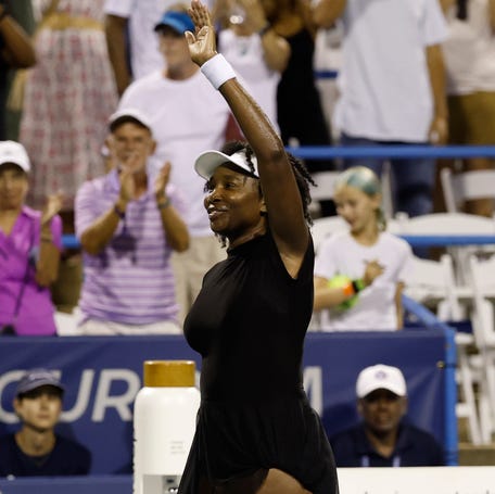 Venus Williams (USA) waves to the crowd after her match against Magdalena Frech in a women's singles match during the DC Open.