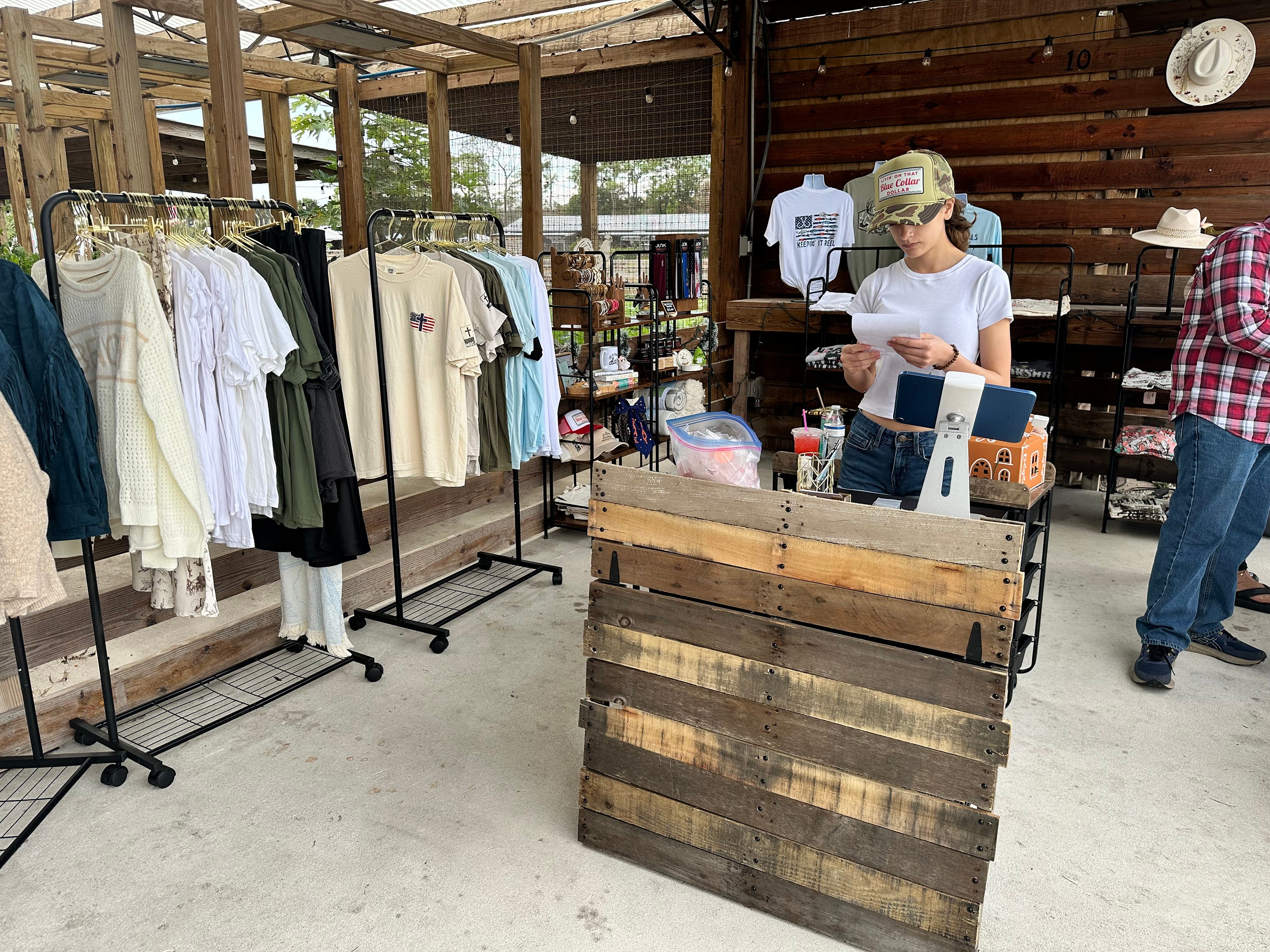 Emma Andres reading over the details of "Convoy of Hope" to offer a chance to customers to make donations.