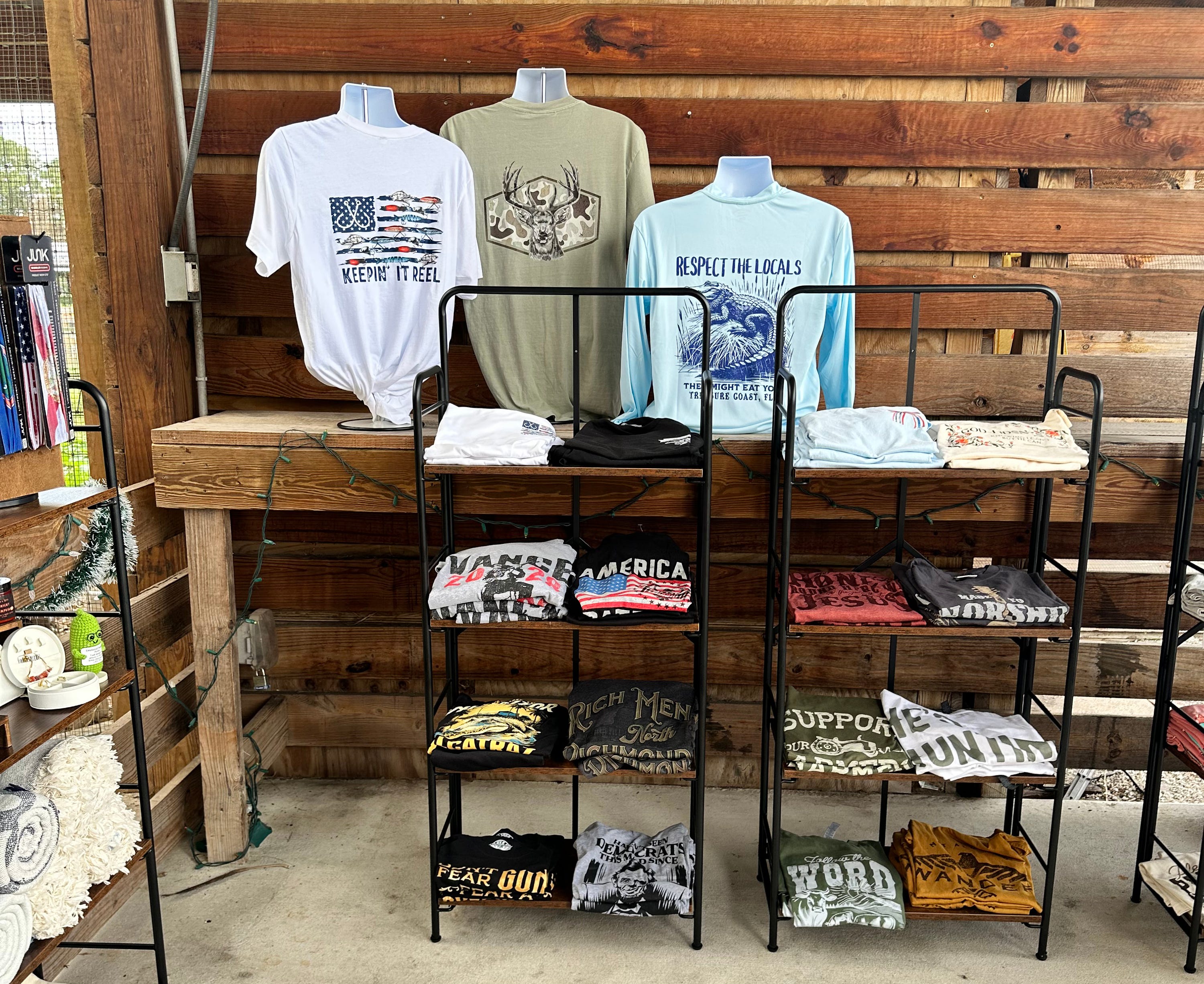 A selection of men's t-shirts that Emma and Zoey Andres offer at the Hobe Sound Farmers market.