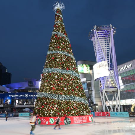 An ice skating rink and Christmas tree at the LA Live Plaza at Crypto.com Arena in Los Angeles on Dec. 23, 2025.