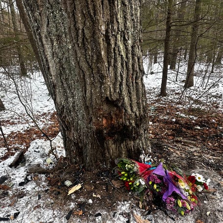 By Friday afternoon, there was a growing collection of flowers at the crash scene.