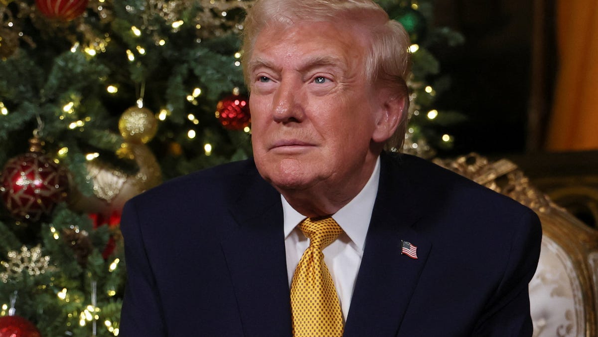 President Donald Trump participates in NORAD Santa tracker phone calls, on Christmas Eve, from the Mar-a-lago club in Palm Beach, Florida, on Dec. 24, 2025.