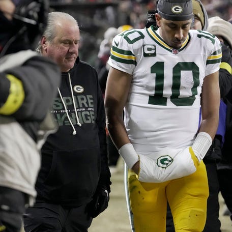Green Bay Packers quarterback Jordan Love (10) walks to the locker room after suffering a concussion during the first quarter of their game against the Chicago Bears Saturday, December 20, 2025 at Soldier Field in Chicago, Illinois.