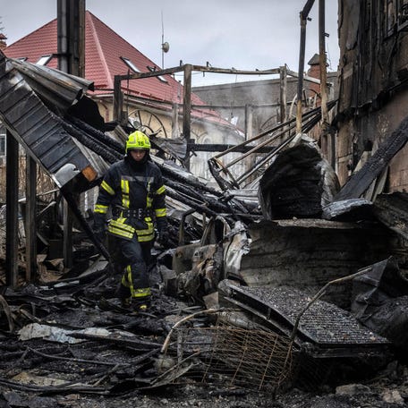 A firefighter walks at the site where a Russian drone struck a residential building during a night of Russian drone and missile attacks, amid Russia's attack on Ukraine, in Kyiv, Ukraine December 27, 2025.