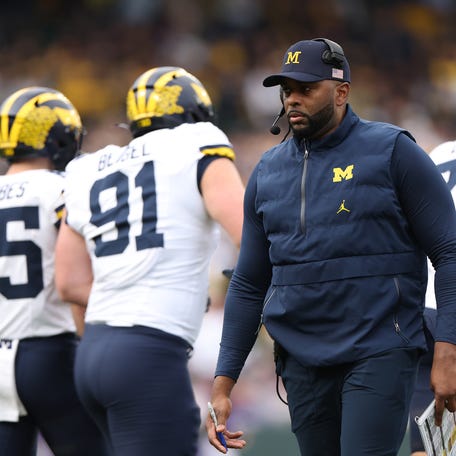 CHICAGO, ILLINOIS - NOVEMBER 15: Head coach Sherrone Moore of the Michigan Wolverines looks on against the Northwestern Wildcats during the first half at Wrigley Field on November 15, 2025 in Chicago, Illinois. (Photo by Michael Reaves/Getty Images)