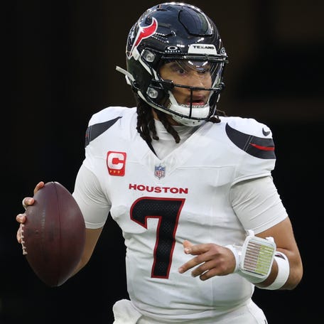 Houston Texans quarterback C.J. Stroud (7) looks downfield as he rolls out against the Los Angeles Chargers during the second half at SoFi Stadium in Inglewood, California on Dec. 27, 2025.