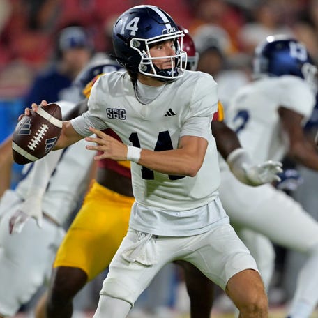 Georgia Southern quarterback Turner Helton (14) sets to pass during his team's game against Southern California at United Airlines Field at the Los Angeles Memorial Coliseum.