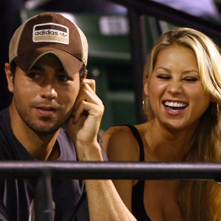 Enrique Iglesias, left, and Anna Kournikova watch as Venus Williams plays her semifinal match against Serena Williams at the Sony Ericsson Open at the Crandon Park Tennis Center in Key Biscayne, Florida, on April 2, 2009.