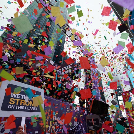 Confetti falls in Times Square during New Year's Eve rehearsals as part of the Planet Fitness test air worthiness of confetti in New York on December 29, 2025.