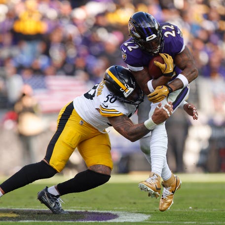 Dec 7, 2025; Baltimore, Maryland, USA; Pittsburgh Steelers linebacker Malik Harrison (50) tackles Baltimore Ravens running back Derrick Henry (22) during the first half at M&T Bank Stadium. Mandatory Credit: Peter Casey-Imagn Images