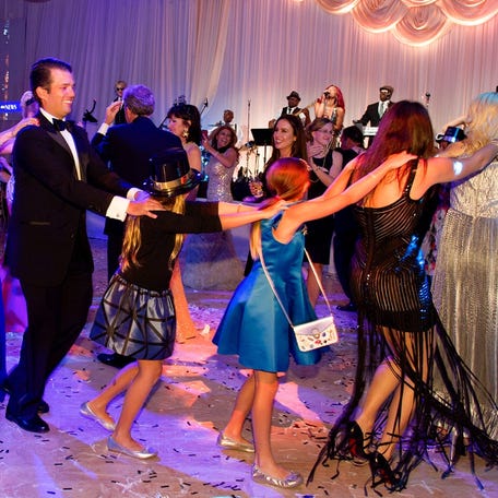 Vanessa and Donald Trump Jr., left, join the conga line after midnight during a New Year's Eve celebration at Mar-a-Lago Club on December 31, 2016, in Palm Beach, Florida.