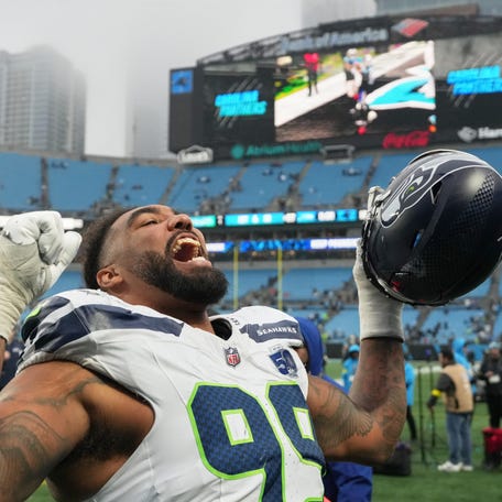 Dec 28, 2025; Charlotte, North Carolina, USA; Seattle Seahawks defensive end Leonard Williams (99) reacts on the field after the game against the Carolina Panthers at Bank of America Stadium. Mandatory Credit: Bob Donnan-Imagn Images