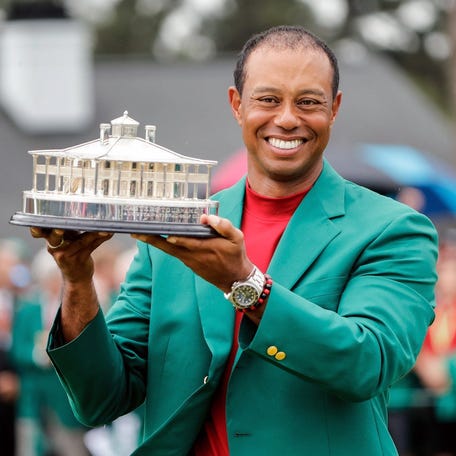 Tiger Woods celebrates during the trophy presentation after winning the Masters Tournament at Augusta National Golf Club, Sunday, April 14, 2019, in Augusta, Ga.