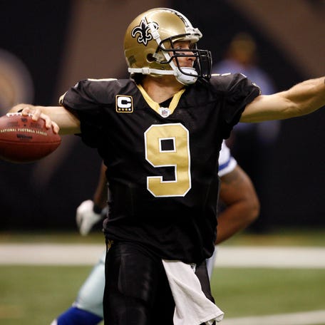 New Orleans Saints quarterback Drew Brees throws a pass against the Dallas Cowboys at the Louisiana Superdome on Dec. 19, 2009.