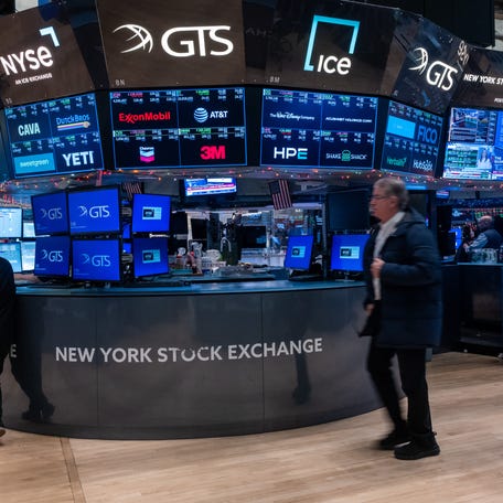 Traders work on the floor of the New York stock Exchange (NYSE) during a shortened trading day before the Christmas holiday on December 24, 2025 in New York City.