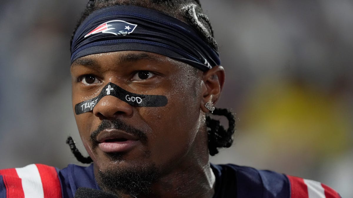 New England Patriots wide receiver Stefon Diggs talks with a sidelines reporter before the Bills home game against the New England Patriots at Highmark Stadium in Orchard Park on Oct. 5, 2025.