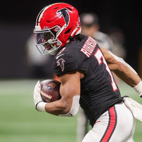 Dec 29, 2025; Atlanta, Georgia, USA; Atlanta Falcons running back Bijan Robinson (7) runs the ball against the Los Angeles Rams in the third quarter at Mercedes-Benz Stadium.