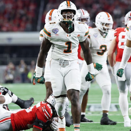 Miami linebacker Mohamed Toure celebrates a defensive play against Ohio State during their 2025 College Football Playoff quarterfinal at the Cotton Bowl.